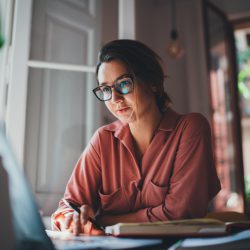 Woman at Computer via Adobe Stock