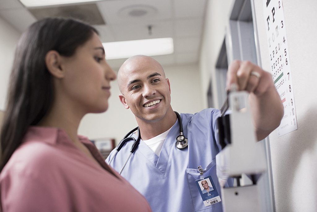 male Nurse Weighing Female